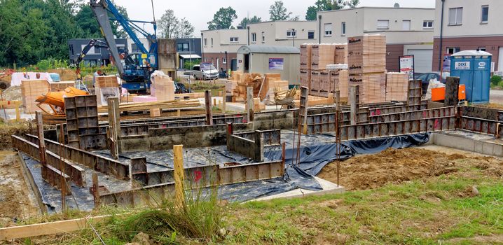 Wolfsburg, Lower Saxony, Germany, August 17,2017: Construction site with casing for the construction of a new single-family house on a clay site with high water level.