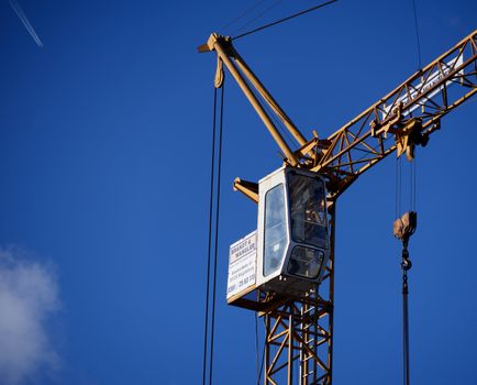 Gifhorn, Lower Saxony, Germany, December 29, 2017:Zoom view of the cab of a construction crane on a construction site