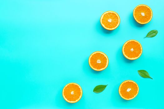 High vitamin C, Juicy and sweet. Fresh orange fruit  on blue background. Top view