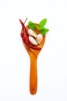 Ingredients herb and spice, holy basil, chili and garlic on white background. Healthy eating concept. Top view