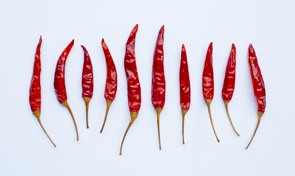 Dry red hot chili peppers on white background