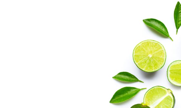 Limes with leaves isolated on white background.