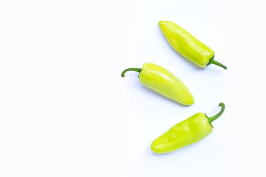 Geen hot peppers on a white background. Copy space