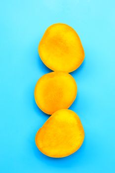 Tropical fruit, Mango on blue background. Top view