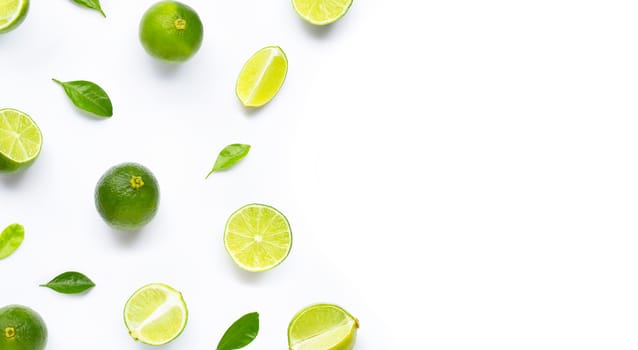 Limes with leaves isolated on white background.