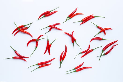 Hot chili peppers on white background. Top view