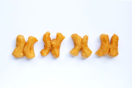 Deep-fried dough stick, chinese bread stick on white background. Copy space