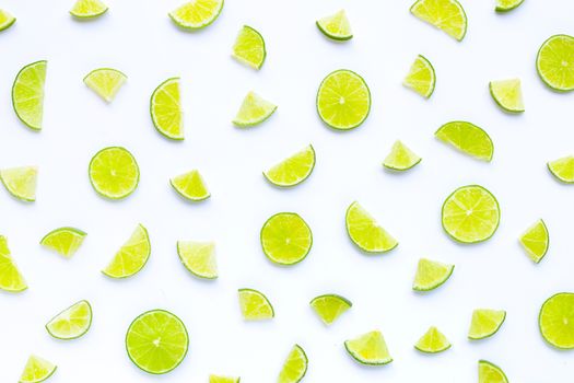 Fresh lime slices on white background. Copy space