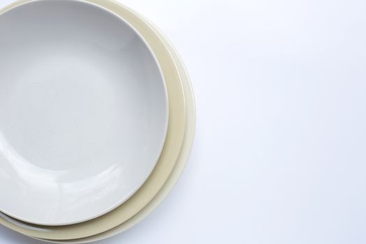 Top view of dishes on white background. Copy space