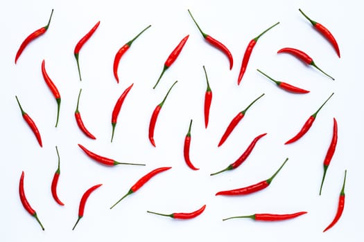Hot chili peppers on white background. Top view