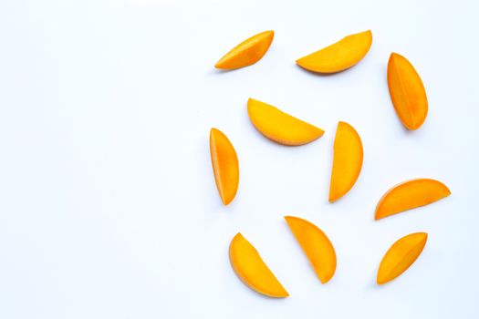 Tropical fruit, Mango slices on white background. Copy space
