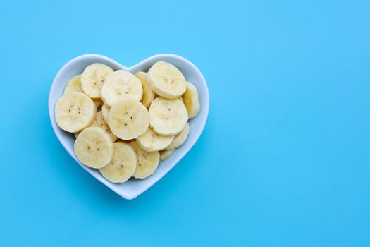 Banana slices on blue  background. Copy space