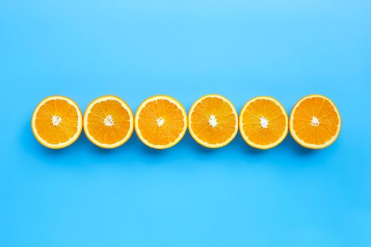 High vitamin C, Juicy and sweet. Fresh orange fruit  on blue background. Top view