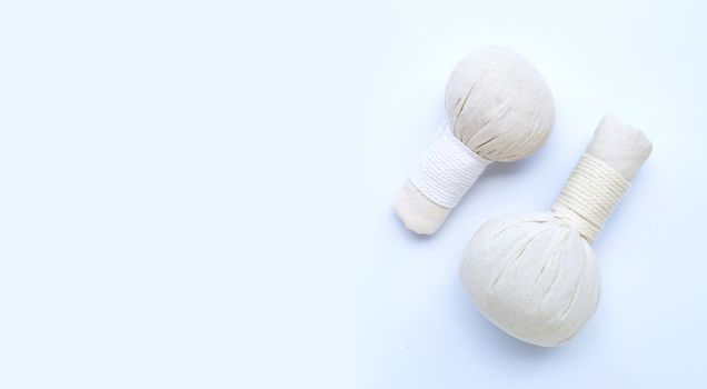 Herbal compress balls for Thai massage and spa treatment  on blue background.  Copy space
