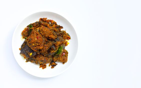 Thai spicy food, Stir fried catfish on dish on white background. Copy space