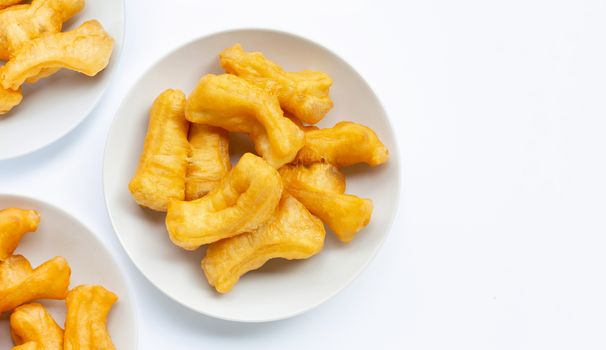 Deep-fried dough stick, chinese bread stick on white background.