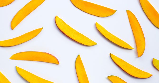 Tropical fruit, Mango  slices on white background. Top view