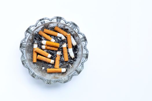 Smoked cigarettes on white background. Copy space