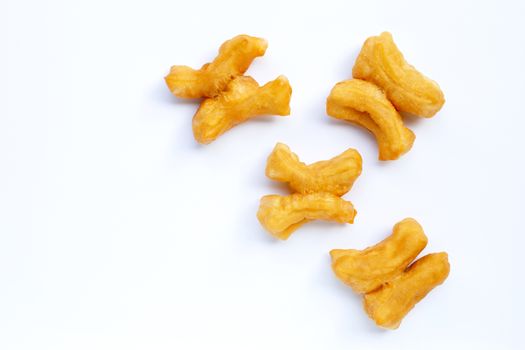 Deep-fried dough stick, chinese bread stick on white background. Copy space