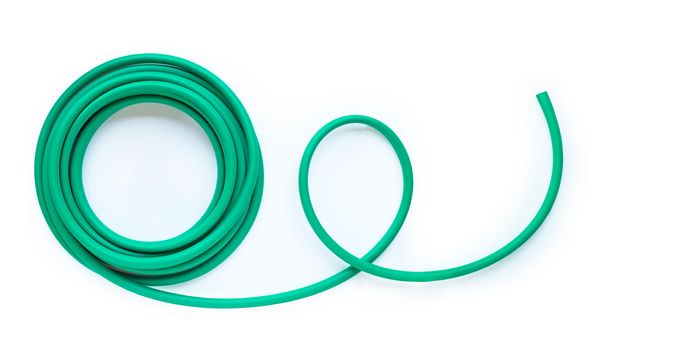 Green garden hose on white background. Copy space