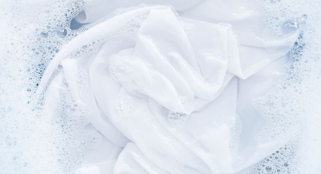 Top view of soak a cloth before washing, white cloth