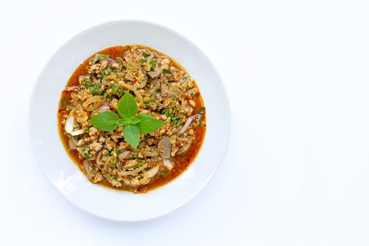 Spicy mince pork salad on white bakcground. Copy space