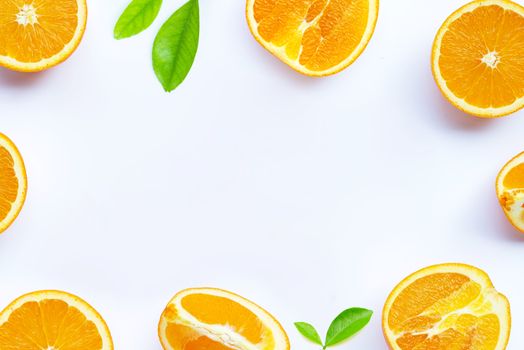 High vitamin C, Juicy and sweet. Frame made of fresh orange fruit with leaves on white background. Copy space