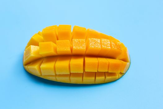 Tropical fruit, Mango  on blue background. Juicy and sweet