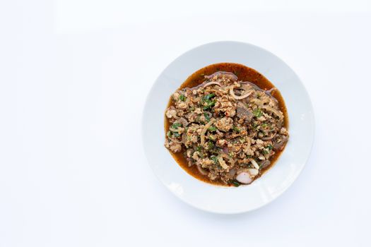 Spicy mince pork salad on white bakcground. Copy space