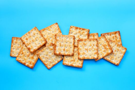 Crackers with sugar  on blue background. Top view