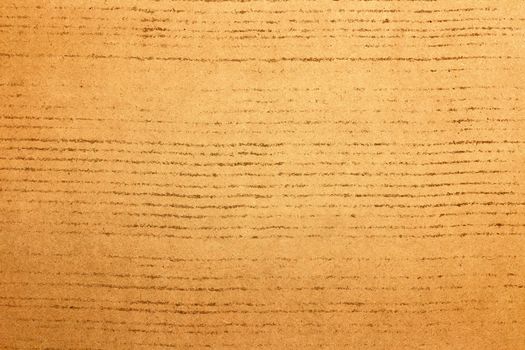 Sheet of brown paper or cardboard texture for background.
