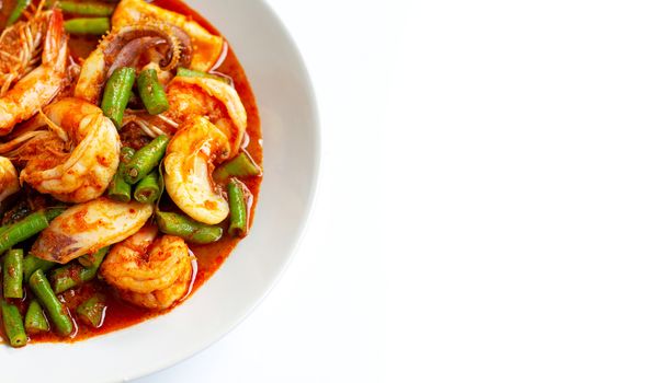 Spicy stir fried seafood and yard long bean with red curry paste. Thai food