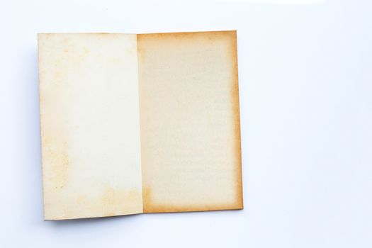 Opened old book isolated on white background. Copy space