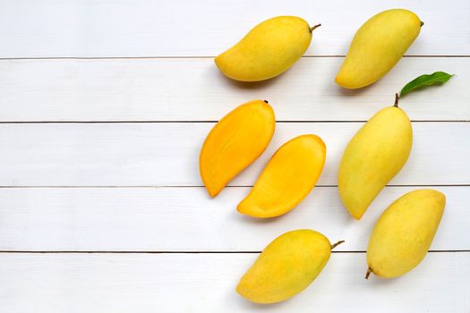 Tropical fruit, Mango  on white wooden background. Copy space