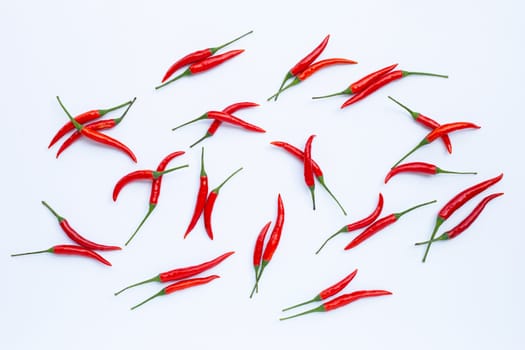 Hot chili peppers on white background. Top view