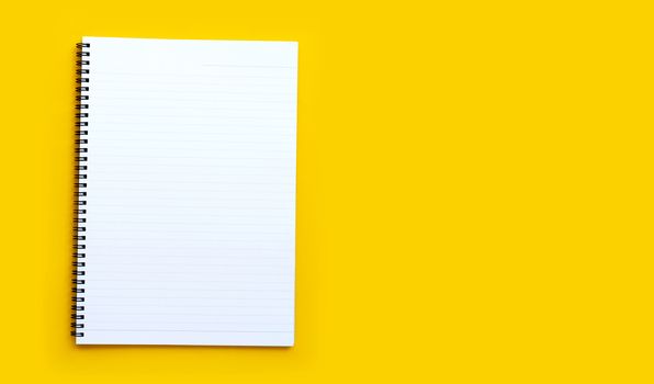 Diary on blue background. Top view with copy space