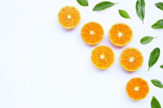 Oranges with leaves on white background. Copy space