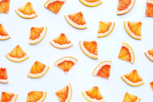 High vitamin C. Juicy grapefruit slices on white background.