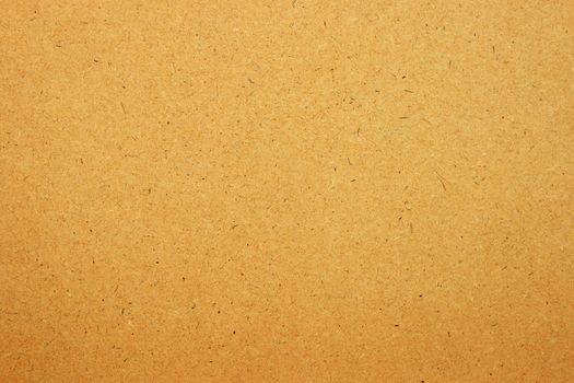 Sheet of brown paper or cardboard texture for background.