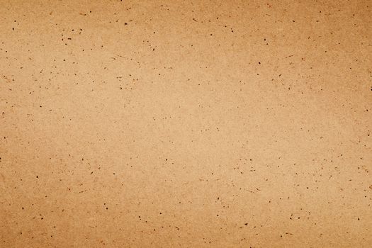 Sheet of brown paper or cardboard texture for background.