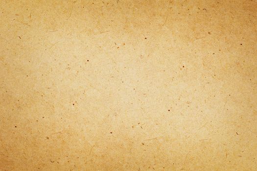 Sheet of brown paper or cardboard texture for background.