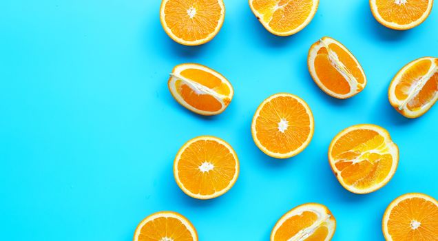 High vitamin C, Juicy and sweet. Fresh orange fruit on blue background. Top view