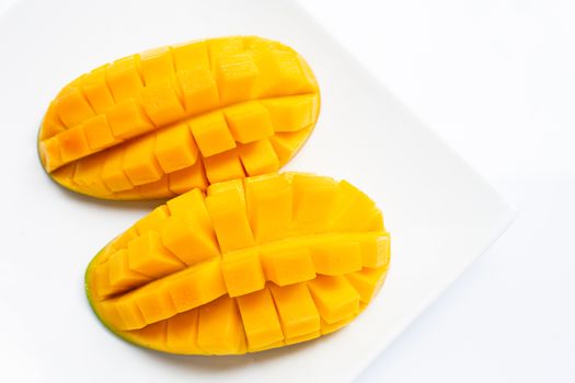 Tropical fruit, Mango  on white plate on white background. 
