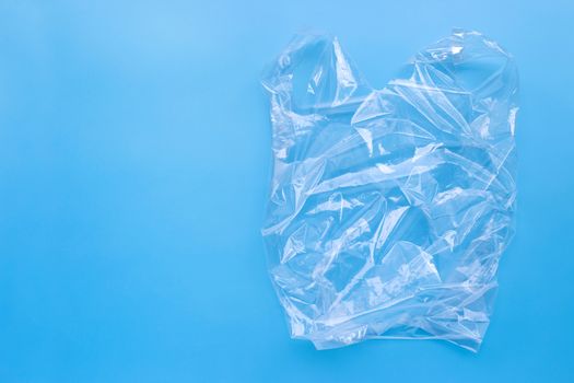 Plastic bag on blue background.  Copy space