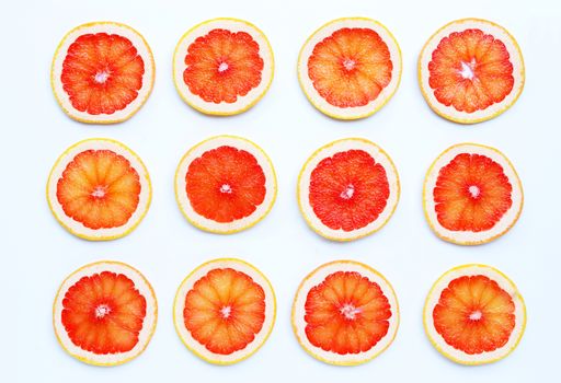 High vitamin C. Juicy grapefruit slices on white background.
