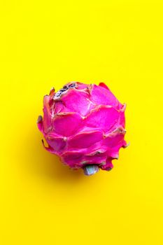 Dragon fruit, pitaya on yellow background.