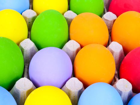 assortments of painted easter eggs on the egg crate