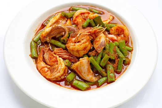 Spicy stir fried seafood and yard long bean with red curry paste. Thai food