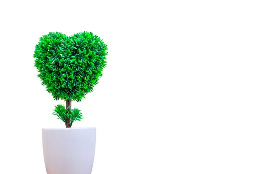 brightly green color artificial heart shape plastic tree in a white pot, isolated on white background with copy space
