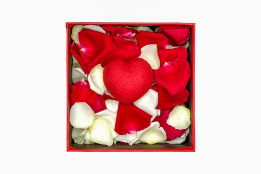 a red handmade paper heart with rose petals in a red paper box, isolated on white background